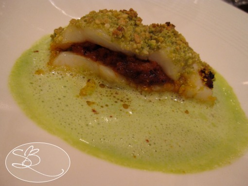 Haddock baked with a pistacio crust, herbed tomato filling, and surrounded by a sea of pea sauce